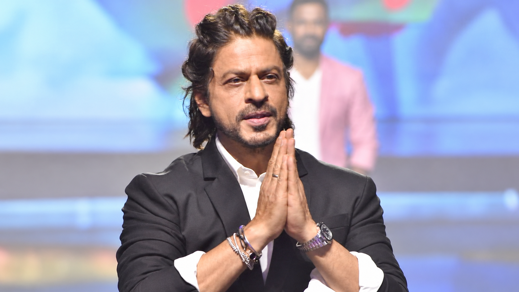 AI-modified archive portrait of Shah Rukh Khan; not a photograph of the reported event.