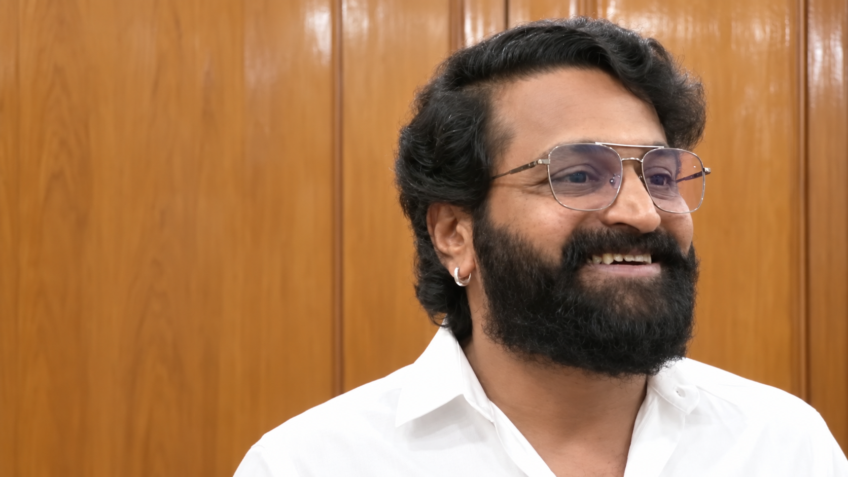 AI-modified licensed archive portrait of Rishab Shetty in February 2023; not a photograph of the Shivaji film announcement or an endorsement.