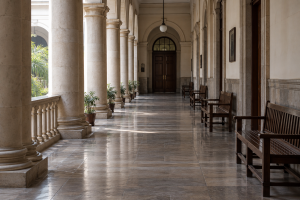 AI-generated photographic-looking editorial image of a generic courthouse corridor; not documentary evidence of the Supreme Court hearing.